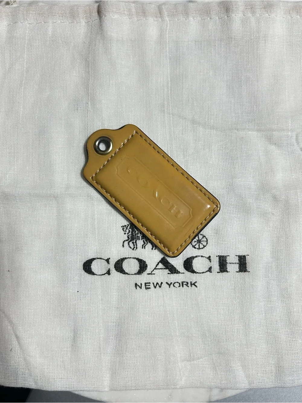 Coach Mustard Leather hang tag